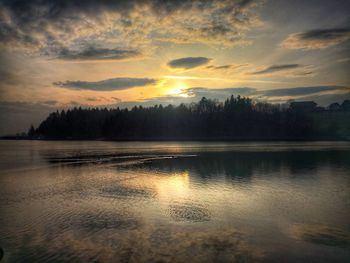 Scenic view of lake against sky during sunset