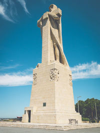 Low angle view of monument against blue sky