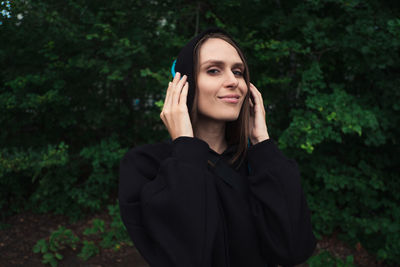 Beautiful young woman using smart phone