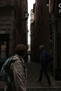 Rear view of woman walking in city