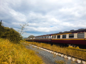 Train on railroad track against sky