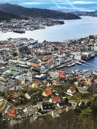 High angle view of townscape by sea