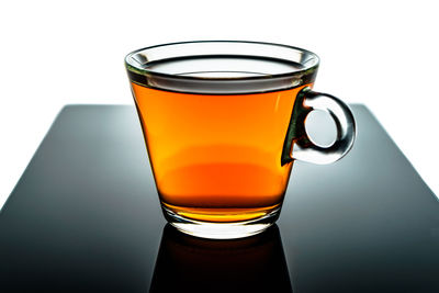 Close-up of tea cup against white background