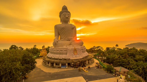 Statue against sky during sunset