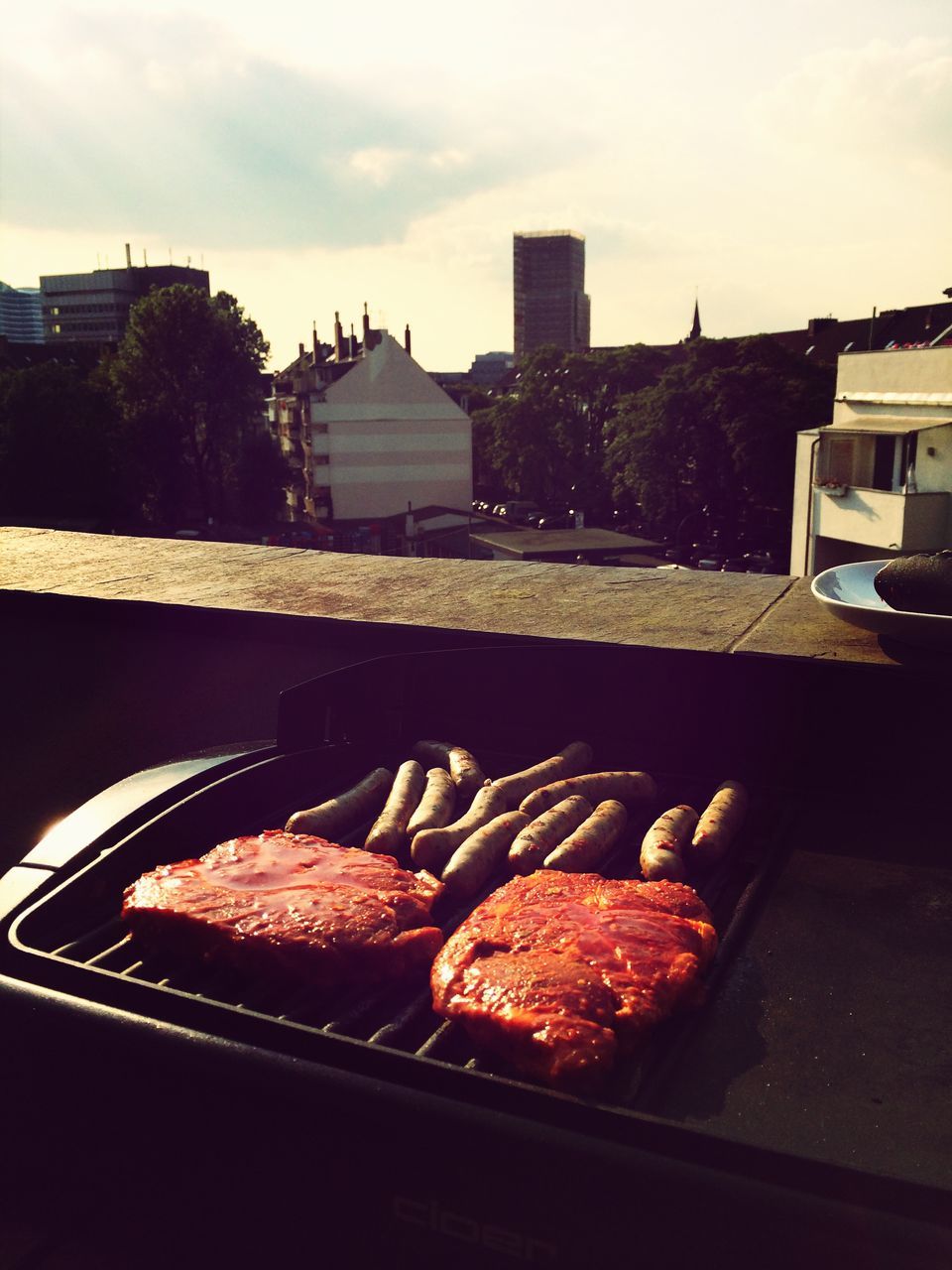 food and drink, food, freshness, table, built structure, architecture, indoors, ready-to-eat, building exterior, no people, high angle view, still life, meat, day, sky, sunlight, close-up, unhealthy eating, bread