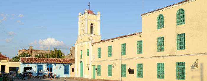 Low angle view of bell tower against sky