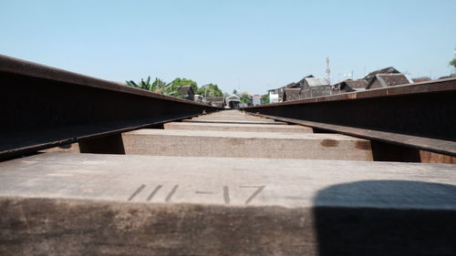 Surface level of bridge against clear sky