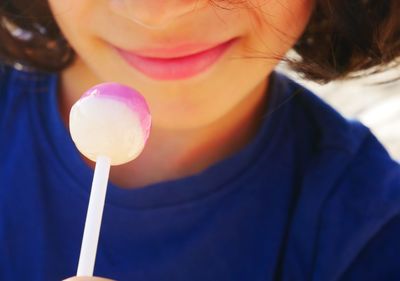 Close-up of kid holding lollipop