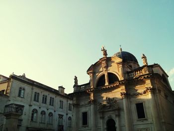 Low angle view of historic building against clear sky