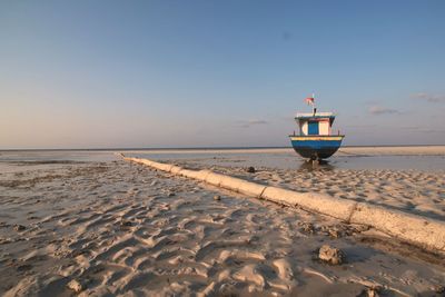 Scenic view of beach against clear sky