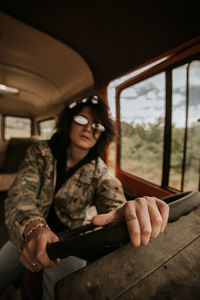 Woman sitting in vehicle