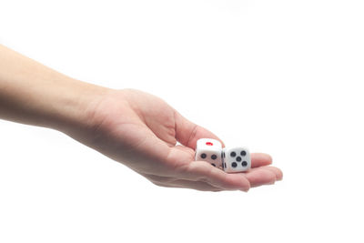 Close-up of hand holding over white background