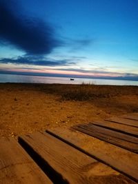 Scenic view of beach against sky during sunset