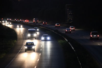 Cars on road at night