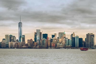 City skyline against cloudy sky