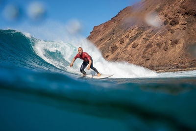 Man surfing in sea