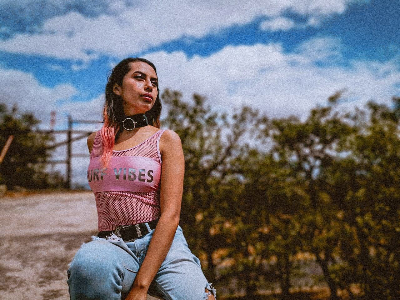 one person, focus on foreground, sky, cloud - sky, casual clothing, real people, nature, tree, lifestyles, women, day, front view, looking, three quarter length, standing, text, leisure activity, brown hair, outdoors, hairstyle