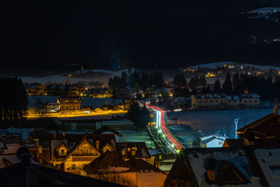 High angle view of illuminated buildings in city at night