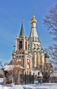 Traditional building against sky during winter