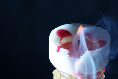 Close-up of ice cream against black background