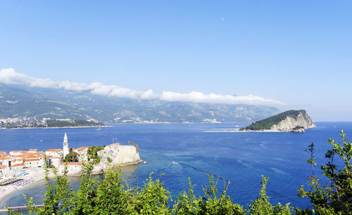 Scenic view of sea against blue sky