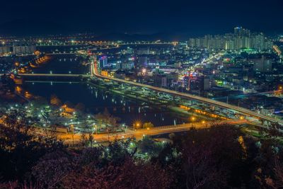 High angle view of illuminated cityscape at night