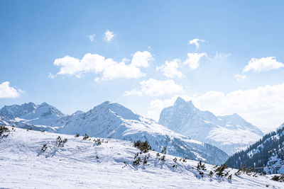 Ski tracks on snow covered mountain range slope