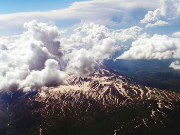 Aerial view of volcanic landscape against sky