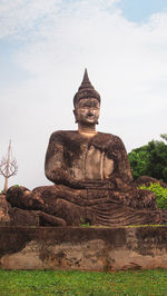 Statue of temple against sky