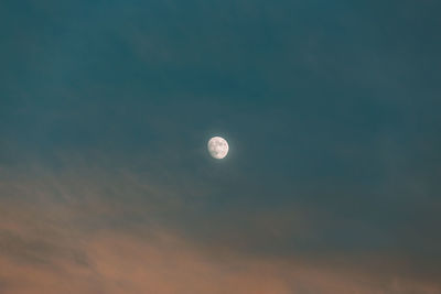 Low angle view of moon in sky at night