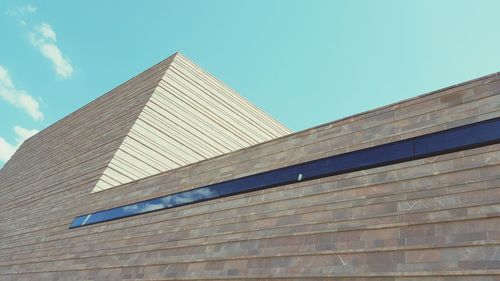 Low angle view of building against blue sky