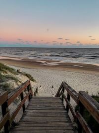 Scenic view of beach against sky during sunset