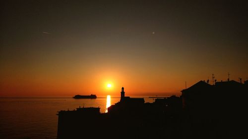 Silhouette of buildings at sunset