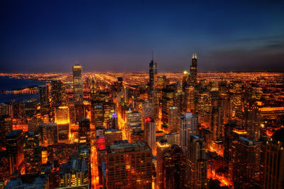 Illuminated buildings in city at night