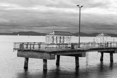 Gazebo by sea against sky