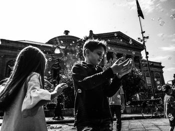 People standing against sky