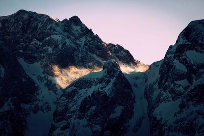 Scenic view of mountains against sky during winter