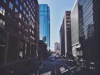 Skyscrapers in city against sky