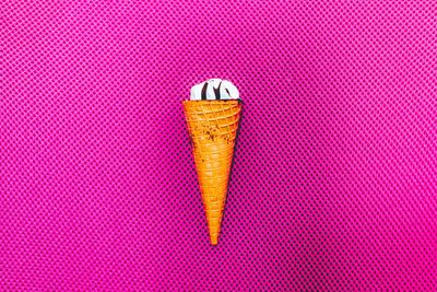 Close-up of ice cream on pink table