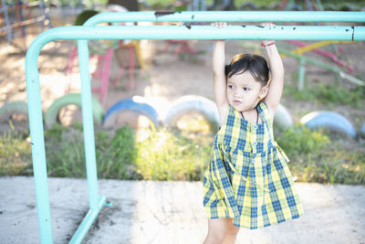 Portrait of cute girl standing in park