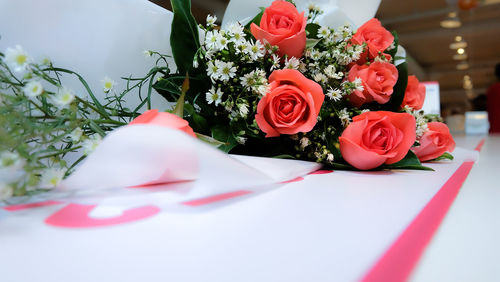 Close-up of rose roses on table