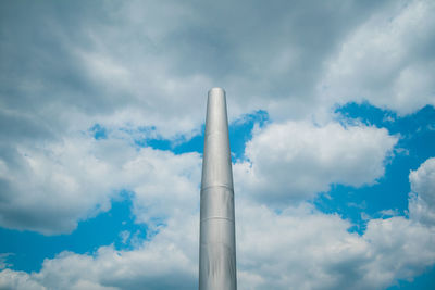 Low angle view of smoke stack against sky