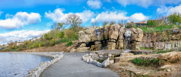 Uman, ukraine. waterfall in the fantasy park nova sofiyivka, uman, ukraine, on a sunny autumn day