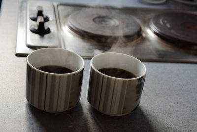 High angle view of coffee cups on table