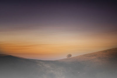 Scenic view of mountain against sky during sunset