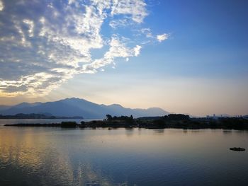 Scenic view of lake against sky during sunset