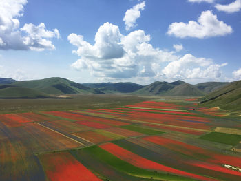 Scenic view of landscape against cloudy sky