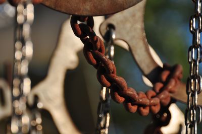 Close-up of chain hanging on metal