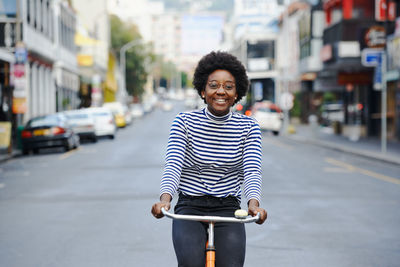 Portrait of smiling man standing on road