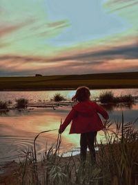 Scenic view of lake against sky during sunset